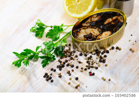 Chipirones in ink with parsley, lemon and spices 103402586