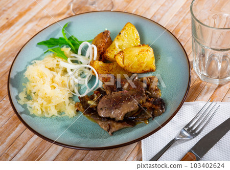 Appetizing fried rabbit liver with vegetables 103402624