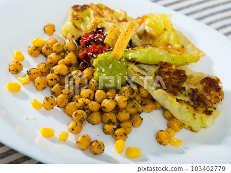 Image of cabbage leaves in batter with garbanzos and sauce Image of cabbage leaves in batter with garbanzos and sauce 103402779