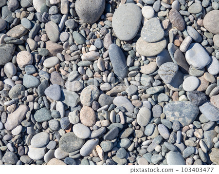 Pebbles on the beach. Background from stones. Smooth gray stones. Pebbles on the beach. Background from stones. Smooth gray stones. 103403477