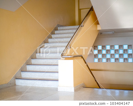 Stairways are concrete in multi-storey buildings and have steel handrails. 103404147