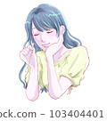 A happy and relaxed girl holding a spoon and holding her cheeks 103404401