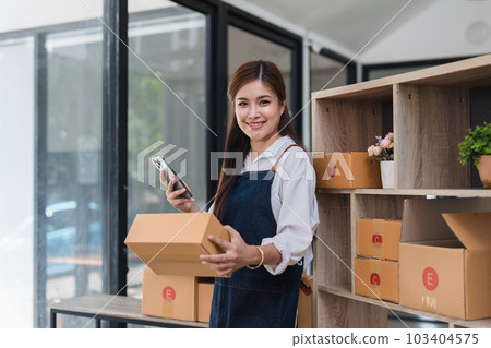 Small businesses SME owners female entrepreneurs working with parcel, e-business, marketing, online shop, sme, entrepreneurs 103404575