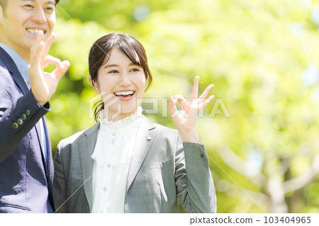 Male and female portrait standing in the fresh green 103404965