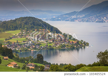Aerial view of Swiss Alps and Lake Thun with ferry boat at sunset, Interlaken 103405524