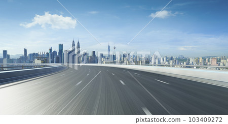 Highway overpass motion blur with city 103409272