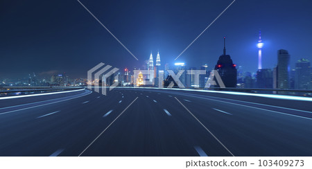 Highway overpass motion blur with city 103409273