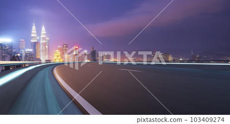 Highway overpass motion blur with city 103409274