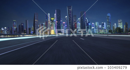 Highway overpass motion blur with city 103409279