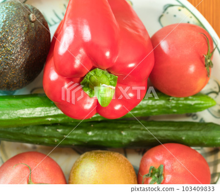 Plate with seasonal summer vegetables and fruits 103409833