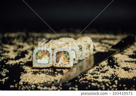 Sai roll sushi with royal prawn, avocado, cream cheese, sesame. Sushi menu. Japanese food 103410571