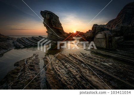 Seal stones in the golden light of sunrise 103411034