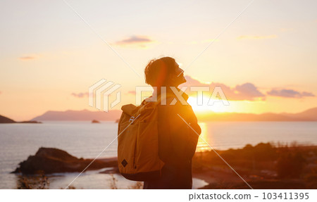 Woman resting alone over the sea shore, Woman resting alone over the sea shore, 103411395