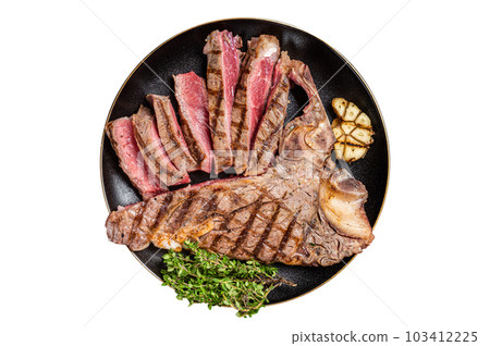 Grilled Medium rare Porterhouse, T-Bone Steak sliced in a plate. Isolated on white background. 103412225