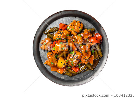 Chicken meat in sweet and sour sauce in a steel tray. Isolated on white background. Chicken meat in sweet and sour sauce in a steel tray. Isolated on white background. 103412323