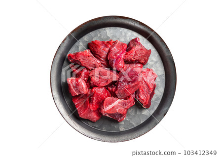 Pieces of raw diced beef fillet meat. Isolated on white background. 103412349