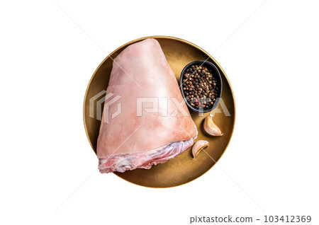 Raw pork ham hocks on a steel plate with herbs. Isolated on white background. Raw pork ham hocks on a steel plate with herbs. Isolated on white background. 103412369