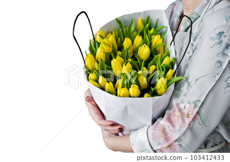 Girl florist holding a bunch of yellow tulips. Floristic. Isolated on white background Girl florist holding a bunch of yellow tulips. Floristic. Isolated on white background 103412433