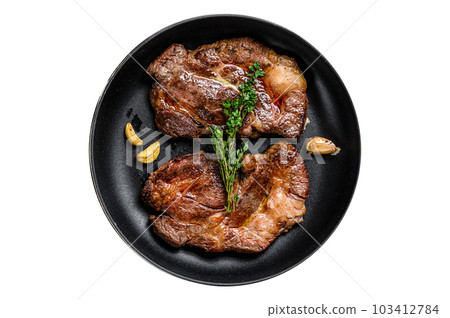 Grilled marble meat steaks Chuck eye roll in a pan. Isolated on white background. 103412784
