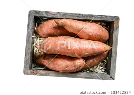 Raw Sweet potato on Wooden table. Isolated on white background. Raw Sweet potato on Wooden table. Isolated on white background. 103412824