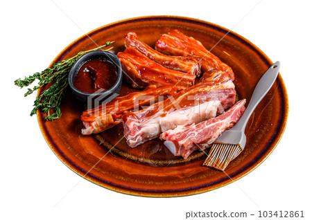 Marinated in bbq sauce sliced veal short spare loin ribs. Isolated on white background. 103412861