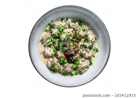 Ground beef meatballs with cream sauce on a plate. Isolated on white background. Ground beef meatballs with cream sauce on a plate. Isolated on white background. 103412933