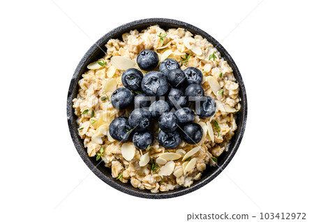Oatmeal porridge with blueberries and almonds. Isolated on white background. Oatmeal porridge with blueberries and almonds. Isolated on white background. 103412972