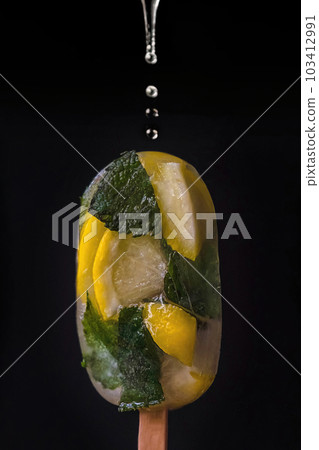 Exquisite Fruit Ice with Citrus Fruits on Dark Background, Drizzled with Juice 103412991