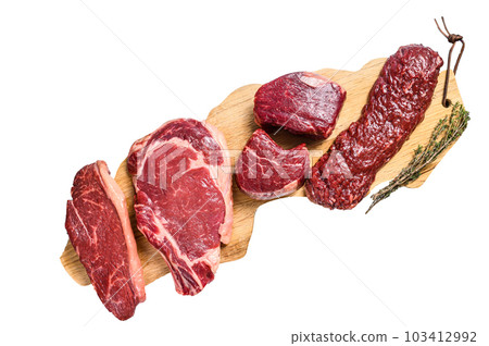 Variety of raw black angus beef meat steaks fillet Mignon, rib eye or cowboy, Striploin or new york, skirt or machete. Isolated on white background. 103412992