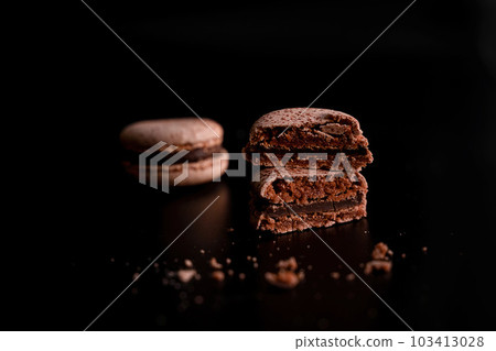 Tempting Cut Chocolate Macaron with Crumbs 103413028