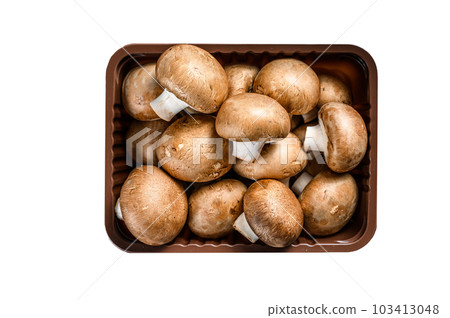 Raw Fresh champignon mushrooms in a plastic box. Isolated on white background. 103413048