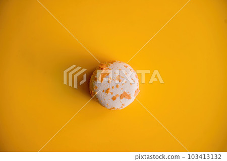 Crunchy Almond Brittle Macaroon on Vibrant Yellow Background 103413132