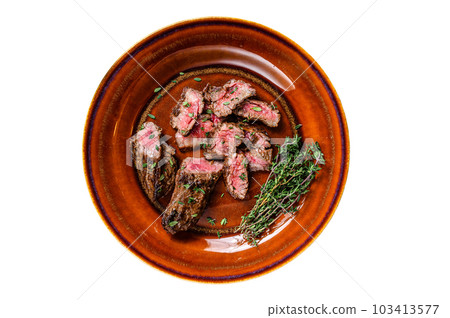 Sliced Grilled barbecue brisket steaks slices on a rustic plate. Isolated on white background. 103413577