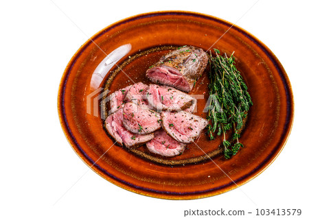 Barbecue Sliced veal tender fillet meat steak on a plate. Isolated on white background. 103413579