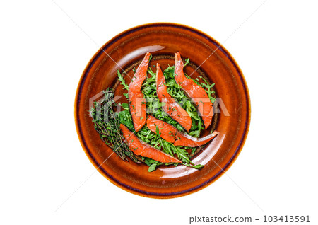 Salad with arugula and smoked salmon fillet slices. Isolated on white background. 103413591