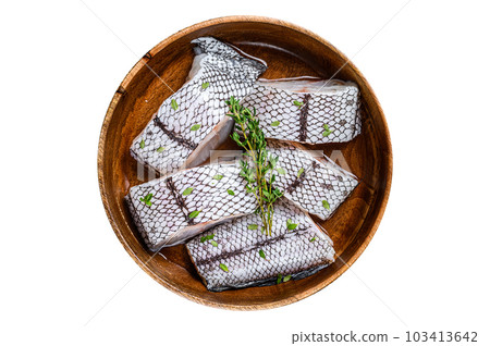 Cut Raw grenadier macrurus white fish without head in a wooden plate. Isolated on white background. 103413642