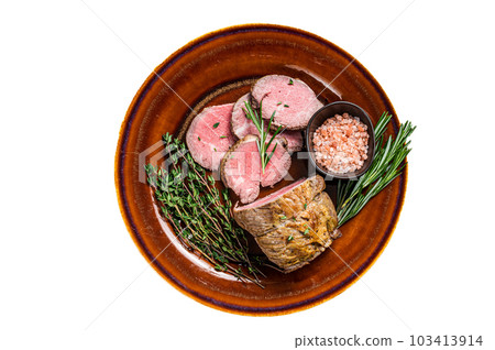 Grilled Roast beef fillet meat on a rustic plate with salt. Isolated on white background. Grilled Roast beef fillet meat on a rustic plate with salt. Isolated on white background. 103413914