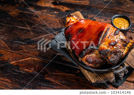 Bavarian Schweinshaxe Roast pork Hock Ham, knuckle with Sauerkraut. Wooden background. Top view. Copy space Bavarian Schweinshaxe Roast pork Hock Ham, knuckle with Sauerkraut. Wooden background. Top view. Copy space 103414146