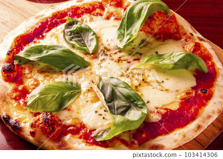 Delicious pizza with plenty of ingredients Delicious pizza with plenty of ingredients 103414306