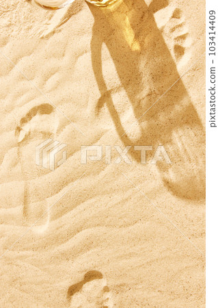 Shadow of beer mug on warm sand. Textured image. Beach chili on warm summer day with cool drink, refreshment and relaxation Shadow of beer mug on warm sand. Textured image. Beach chili on warm summer day with cool drink, refreshment and relaxation 103414409