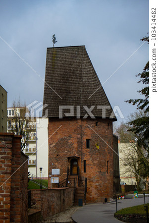 Round tower in the historic surrounding city wall of Slupsk, Poland. Witches tower - Baszta Czarownic. Sights of Poland. Old jail. Travel destination 103414482