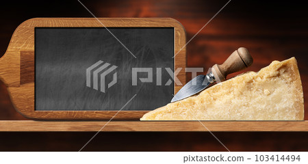 Slice of Italian Parmesan Cheese and Knife on a Wooden Table Slice of Italian Parmesan Cheese and Knife on a Wooden Table 103414494