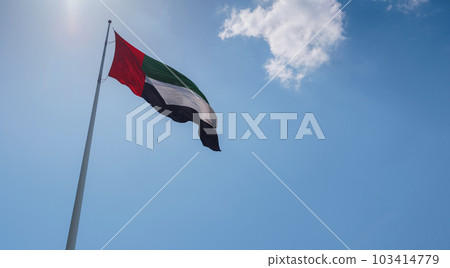 United Arab Emirates flag flying against sky. 103414779