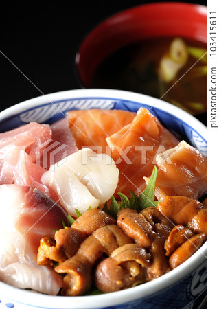 Seafood rice bowl with tuna, salmon, sea bream, scallop, and sea urchin and red miso soup 103415611