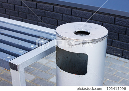 Gray street waste bin with ashtray closeup Gray street waste bin with ashtray closeup 103415996