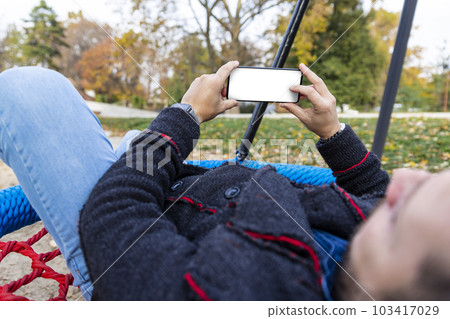Man using smartphone. Blank white screen for copy space Man using smartphone. Blank white screen for copy space 103417029