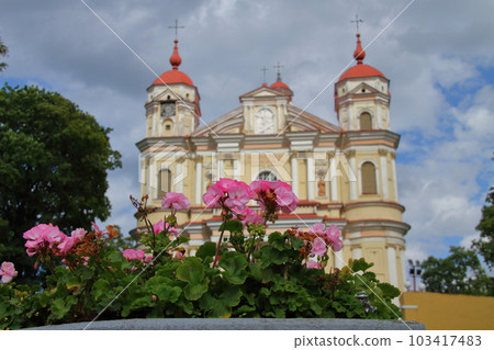 Church of St. Peter and Paul over flowers on the outskirts of Vilnius Historic Center, a world cultural heritage site in the Northern European Baltic States of Lithuania Church of St. Peter and Paul over flowers on the outskirts of Vilnius Historic Center, a world cultural heritage site in the Northern European Baltic States of Lithuania 103417483