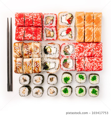 Big colorful sushi set on a white background. Top view. Big colorful sushi set on a white background. Top view. 103417753