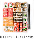Big colorful sushi set on a white background. Top view. 103417756