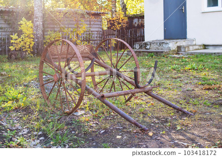 Old retro metal cart in the garden Old retro metal cart in the garden 103418172